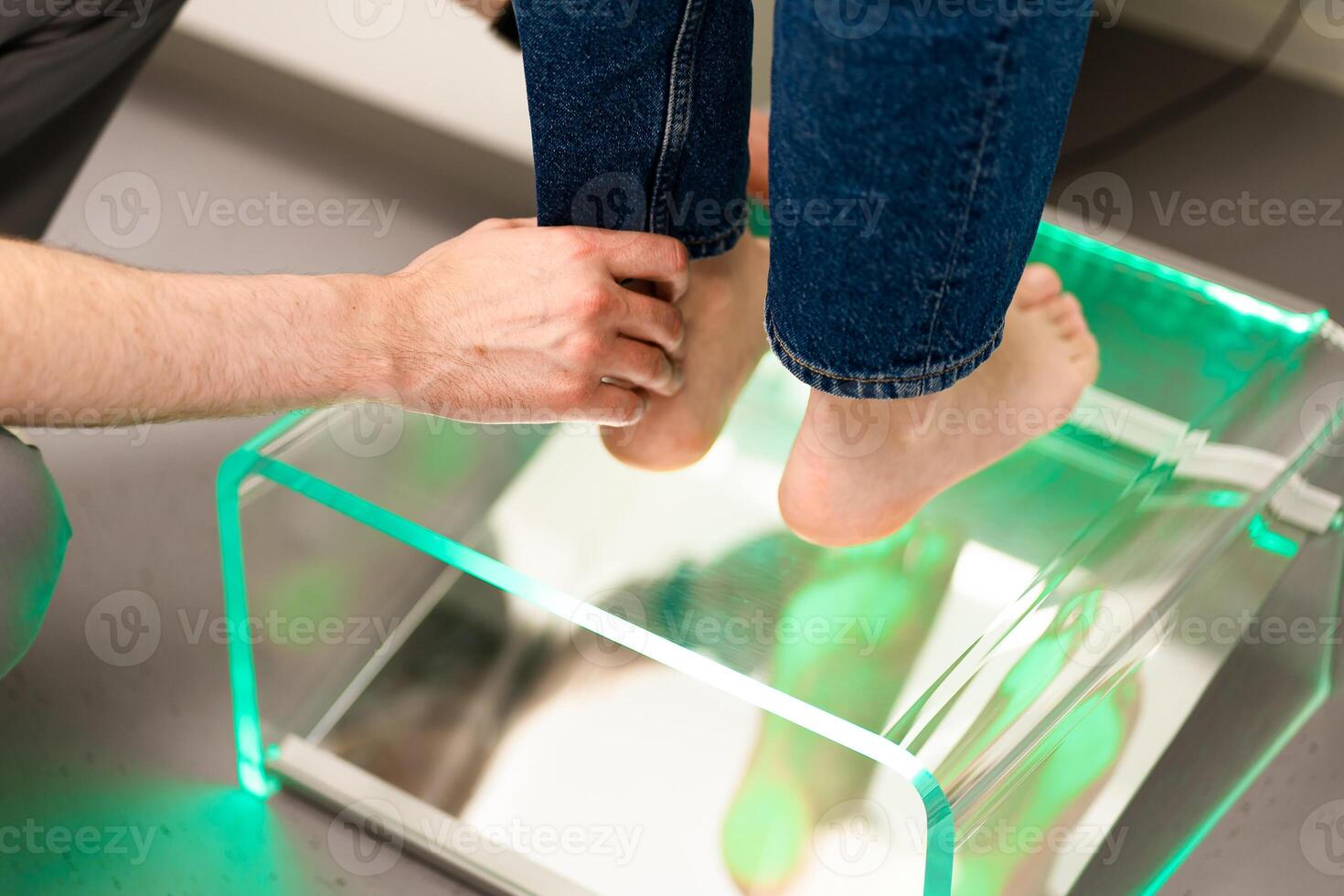Orthopedic insole. The orthopedist works with the patient. Orthopedic clinic. Choice of insoles in an orthopedic clinic. The orthopedist offers the insole to the patient Foot care photo