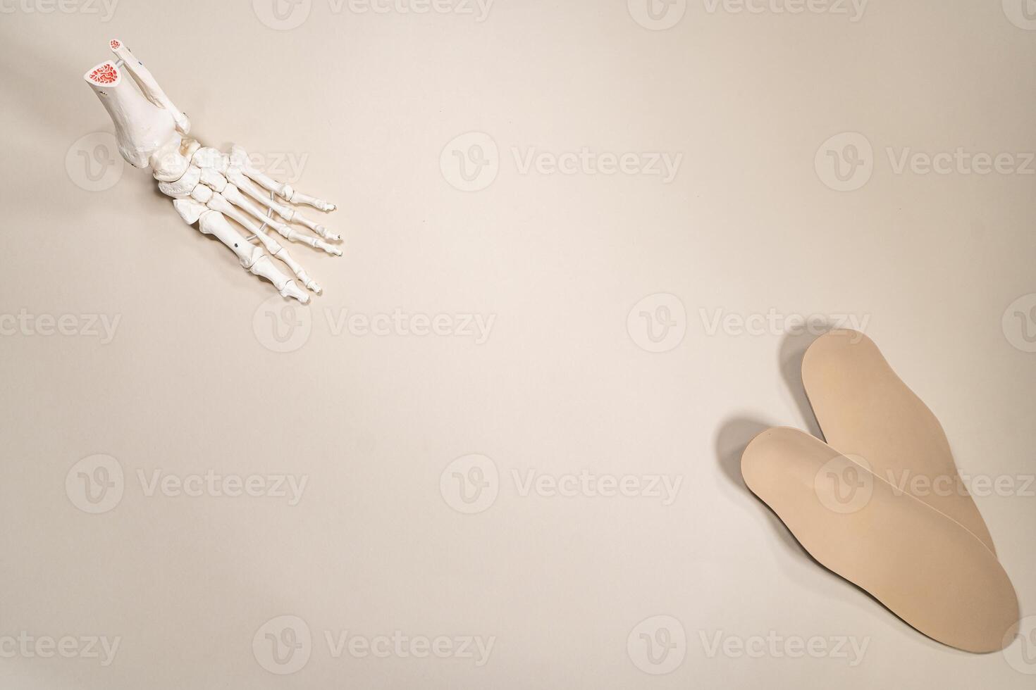 Orthopedic insoles for shoes on a colour background. Foot care photo