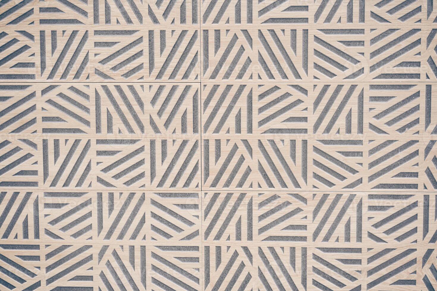 Light stone tiles with an original pattern of lines in a geometric style. Stone texture with space to copy photo