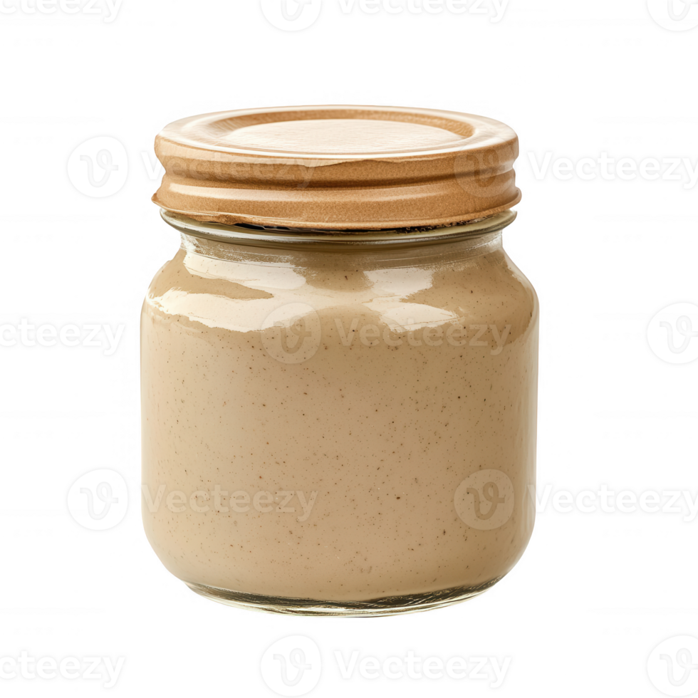 A glass jar filled with creamy nut butter, ideal for healthy snacking and cooking. png