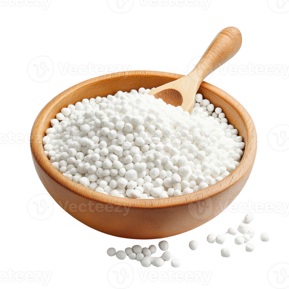 A bowl of white tapioca pearls with a wooden scoop, perfect for desserts and drinks. png