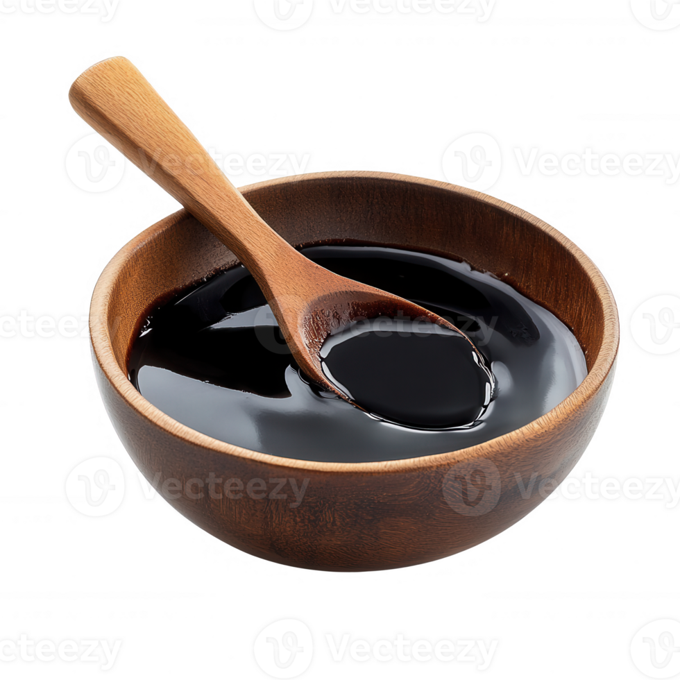 Dark sauce in a wooden bowl with a spoon, perfect for culinary presentations. png