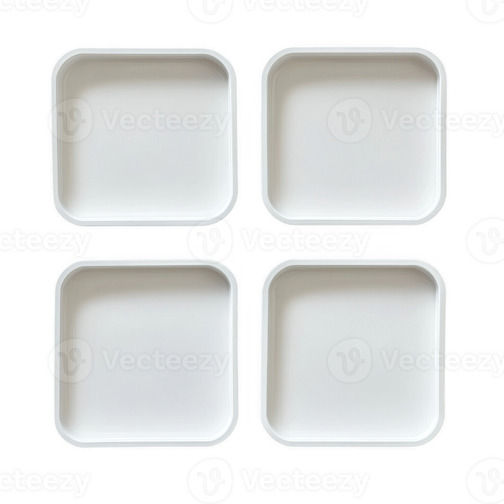A set of four empty white square plates arranged neatly on a plain surface. png