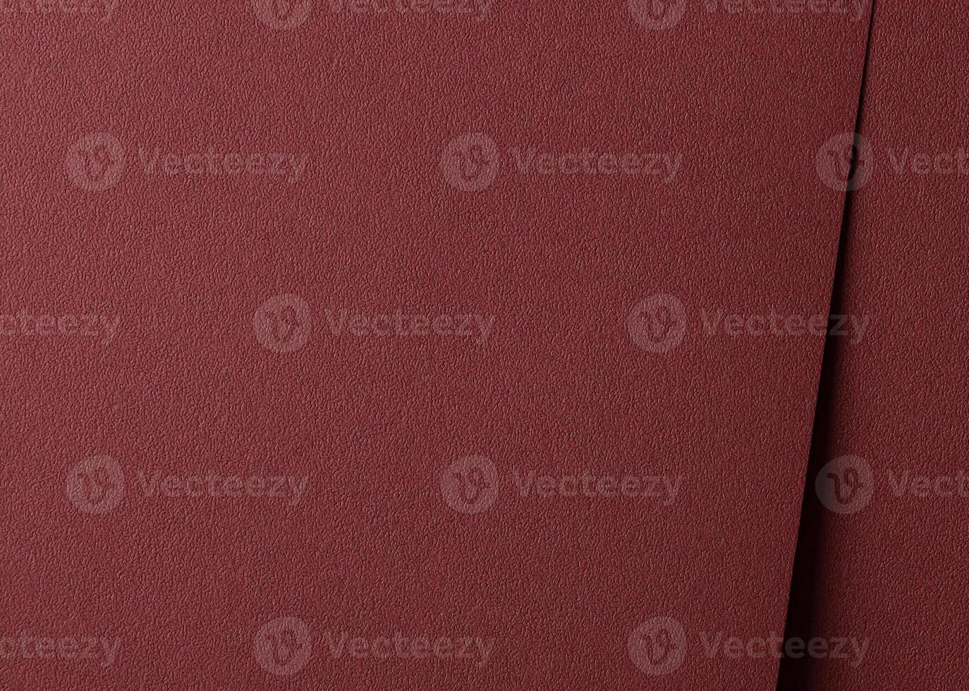 Luxury paper texture in deep marsala and brick red hues. Matte and grainy surface with a rich, photo