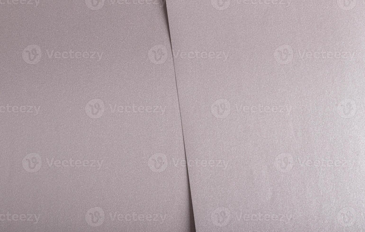 Soft gray paper texture with a satin metallic finish in taupe and sepia tones, featuring a subtle photo