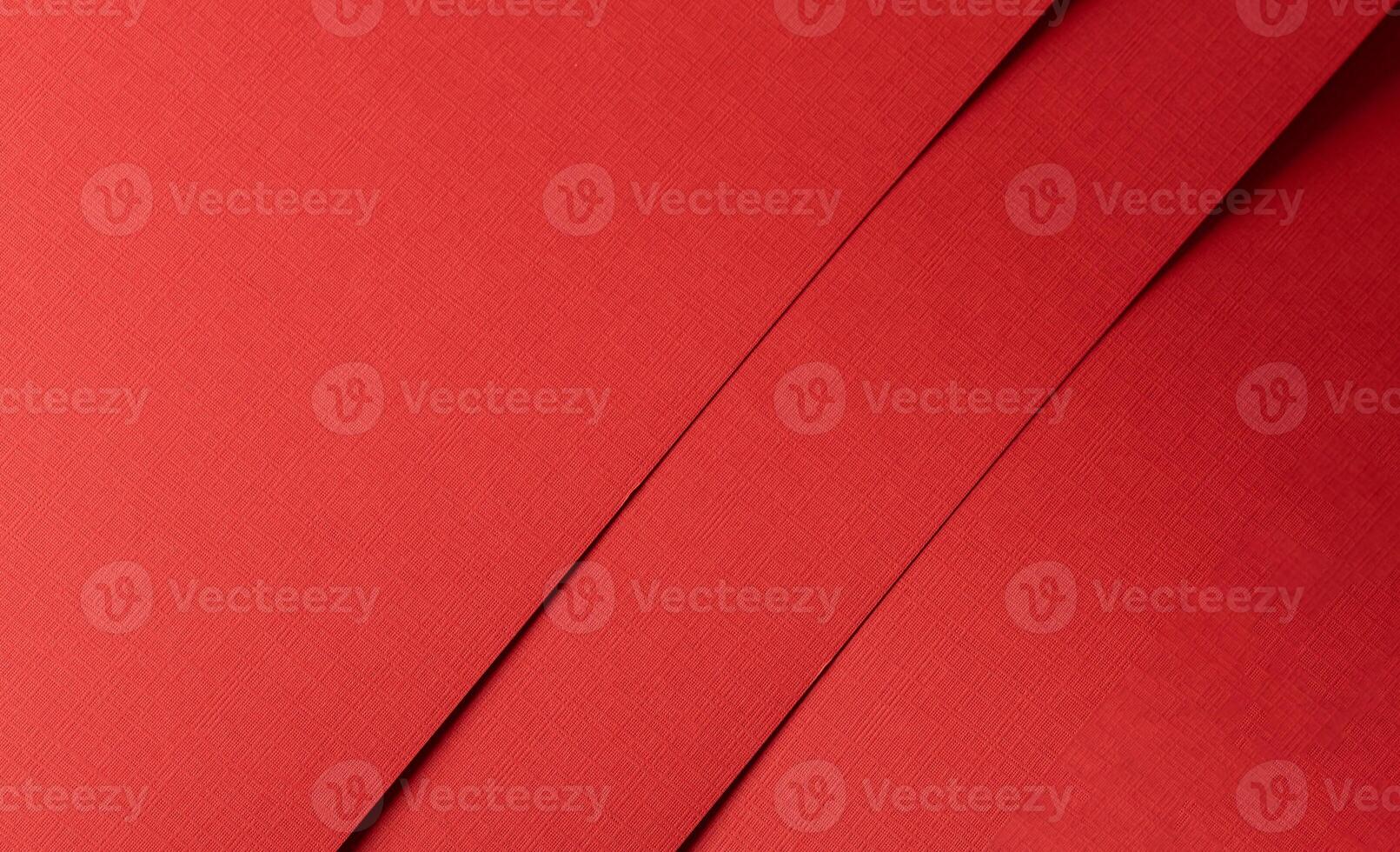 Crimson paper texture with deep ruby tones and a crosshatch pattern of fine, detailed lines. The photo