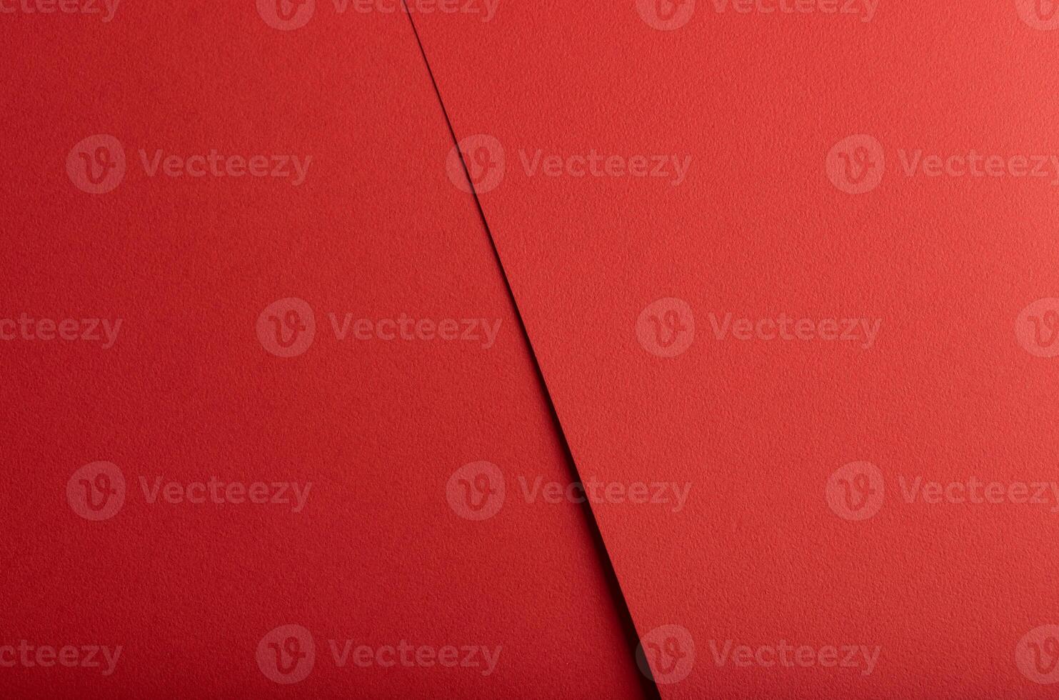 Scarlet red paper texture with bold, layered elements and a rough, dynamic surface. The warm tone photo