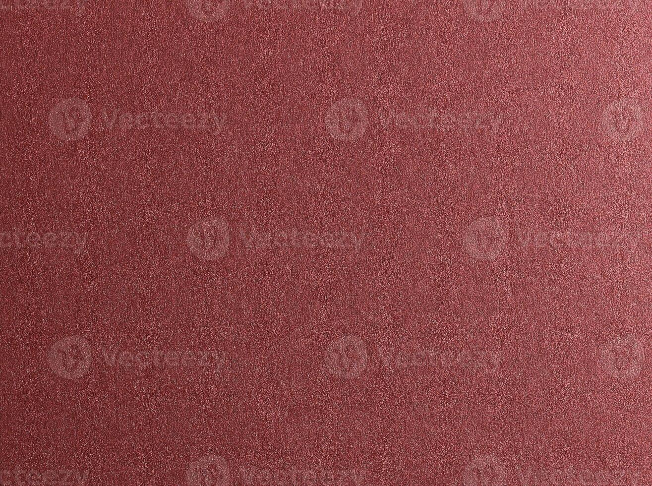 Burgundy red metallic paper texture with a glossy satin finish and subtle gradient. The warm photo