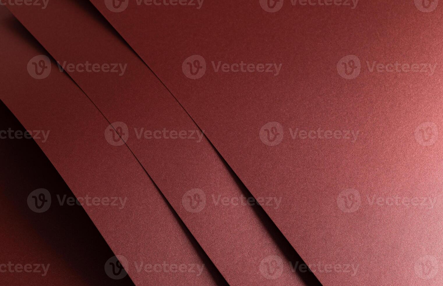 Burgundy red metallic paper texture with a pearlescent finish and a sleek, smooth surface. The warm photo