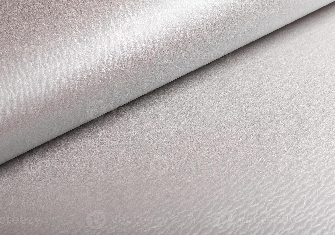 Pearl off-white gray paper texture with a glossy satin sheen and wavy patterns. The creamy, greige photo