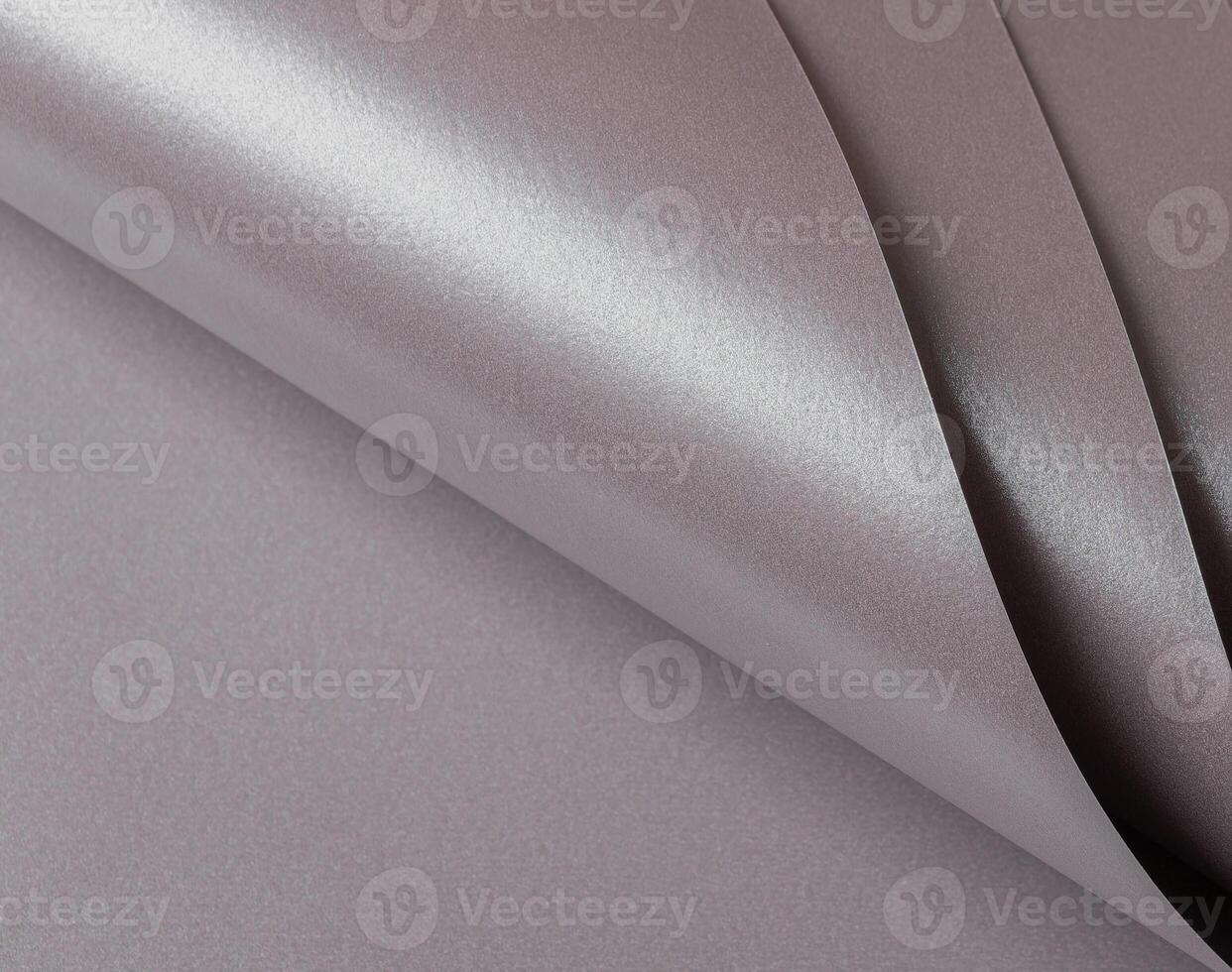 Soft gray paper texture with a metallic finish in taupe, sepia, and grayish pink with a subtle pink photo