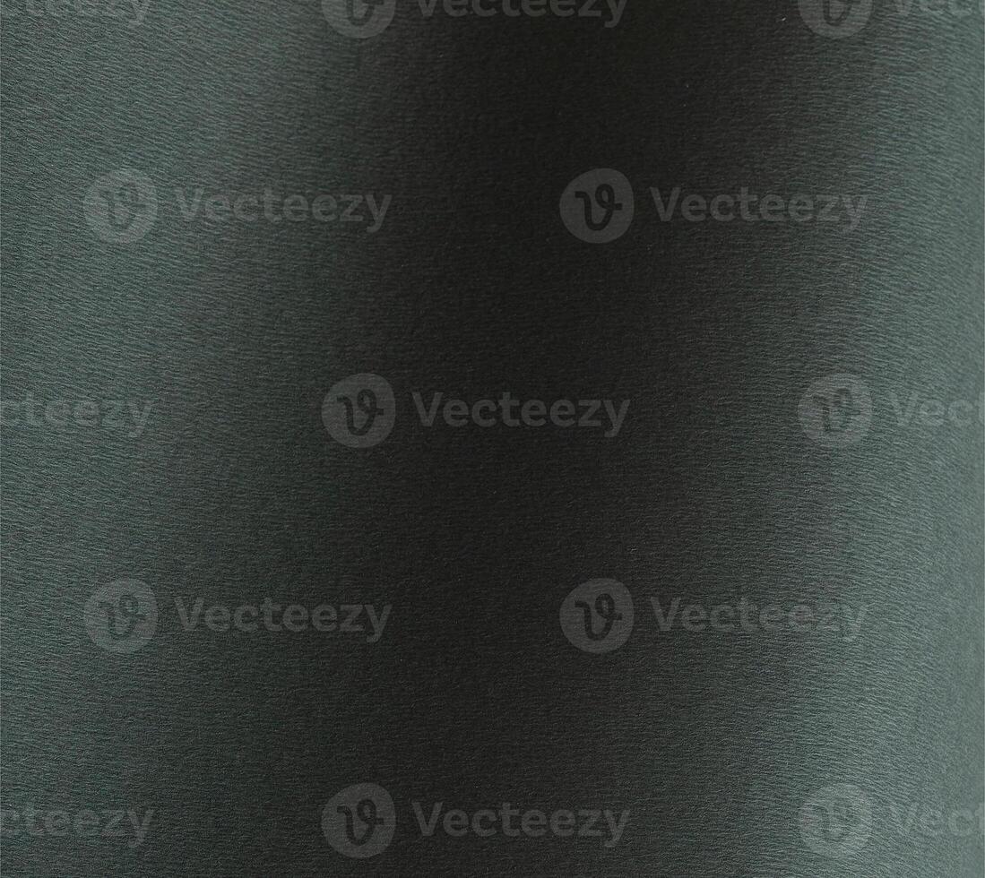 Dark green paper texture with an embossed wavy leather like pattern in forest green and deep teal photo