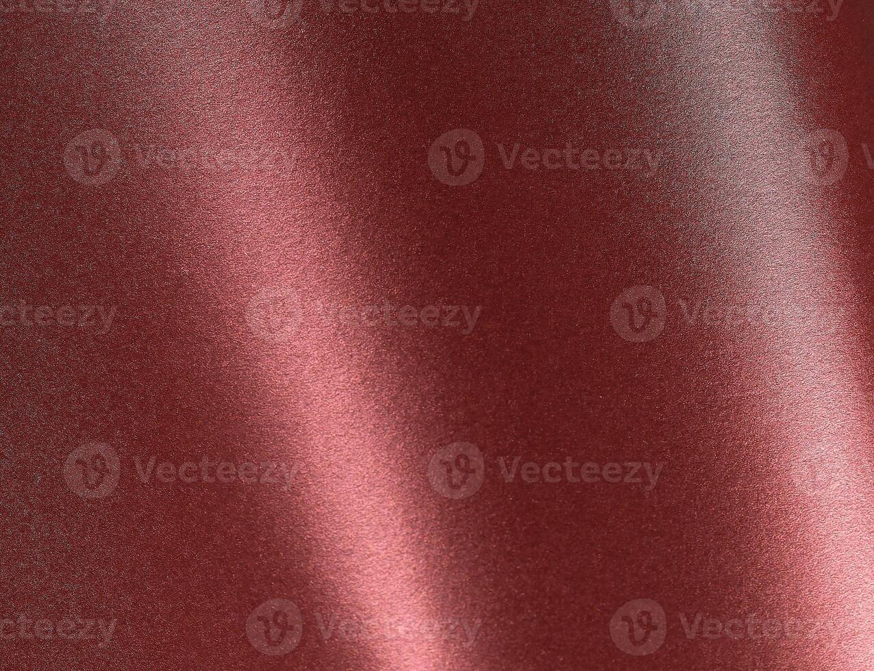 Burgundy red metallic paper texture with a pearlescent finish and warm red-brown tones. The glossy photo