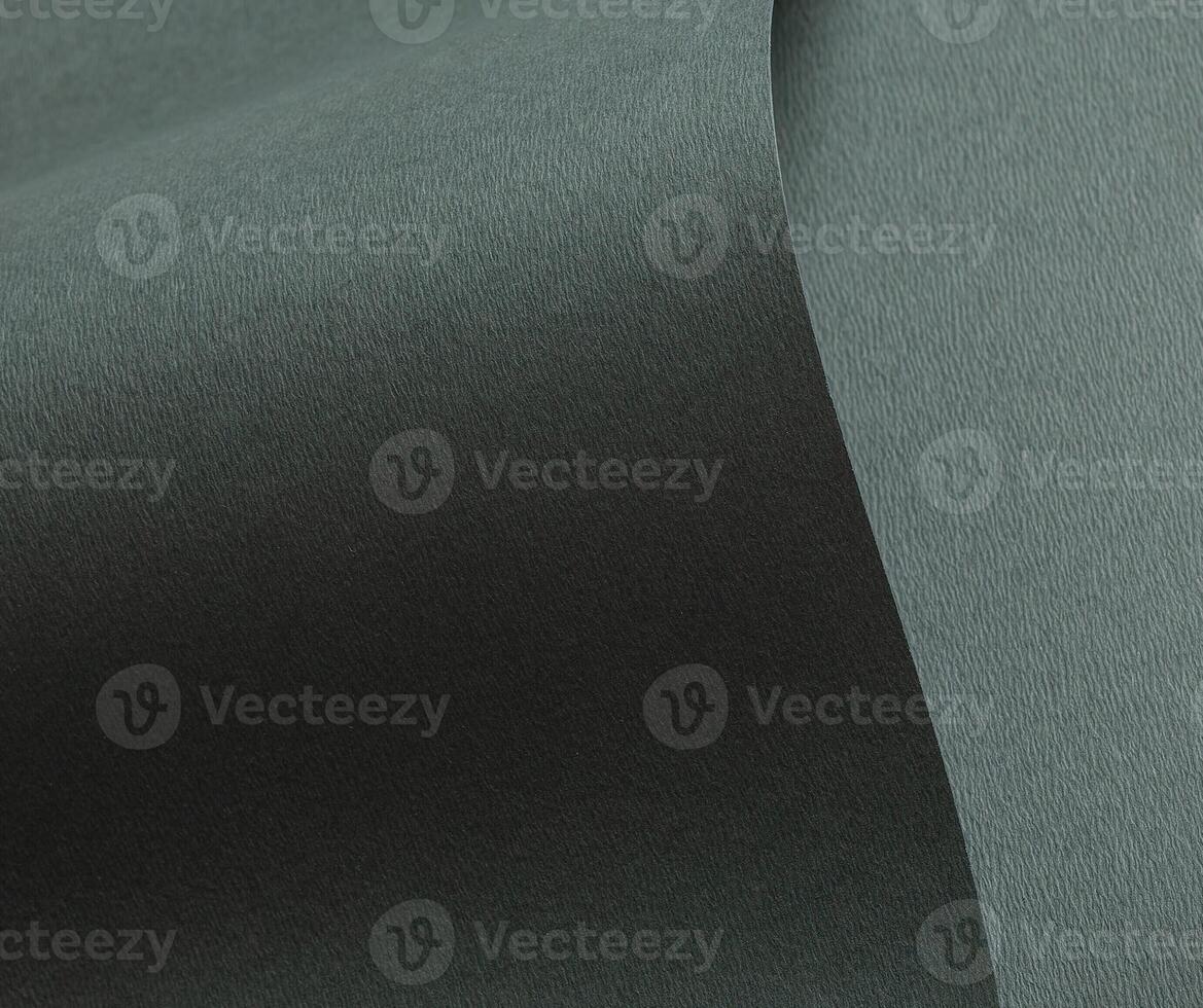 Dark green paper texture with a wavy embossed design and subtle gradient in forest green and deep photo
