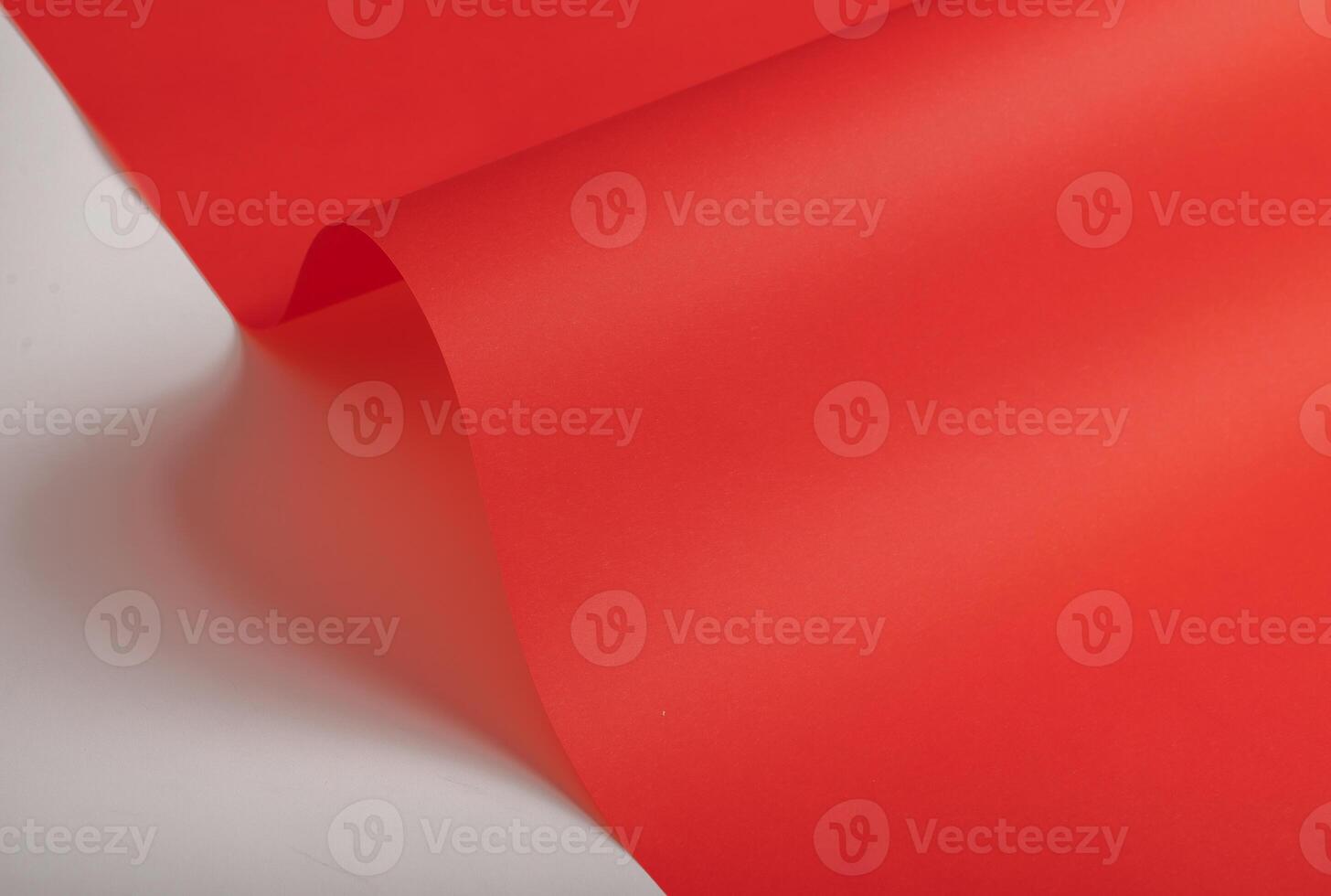 Elegant scarlet red paper background with a fine texture and subtle gradient. Featuring soft folds photo