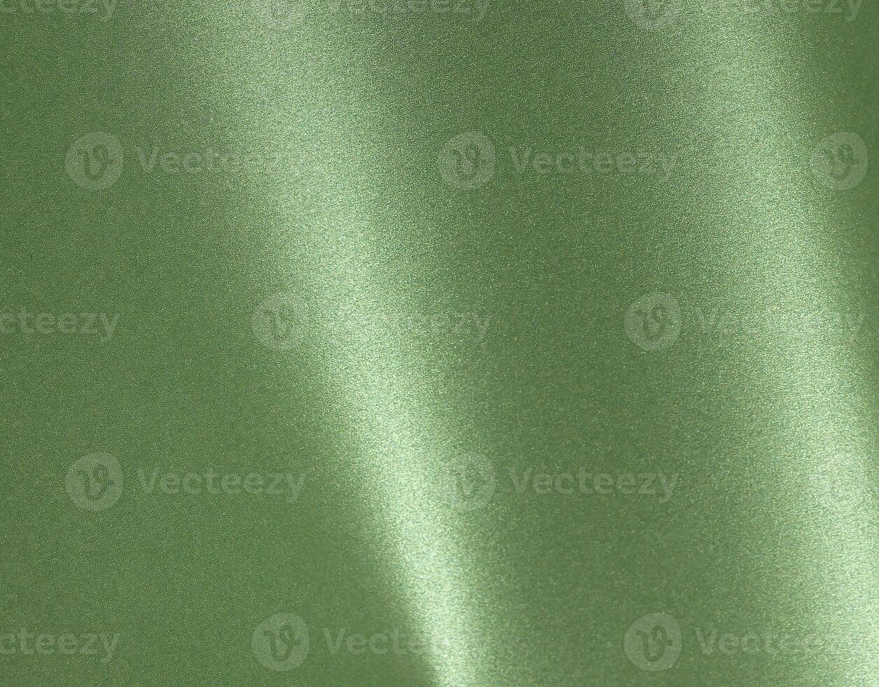 Luxurious green paper background with a smooth satin finish and rich metallic sheen. The monochrome photo