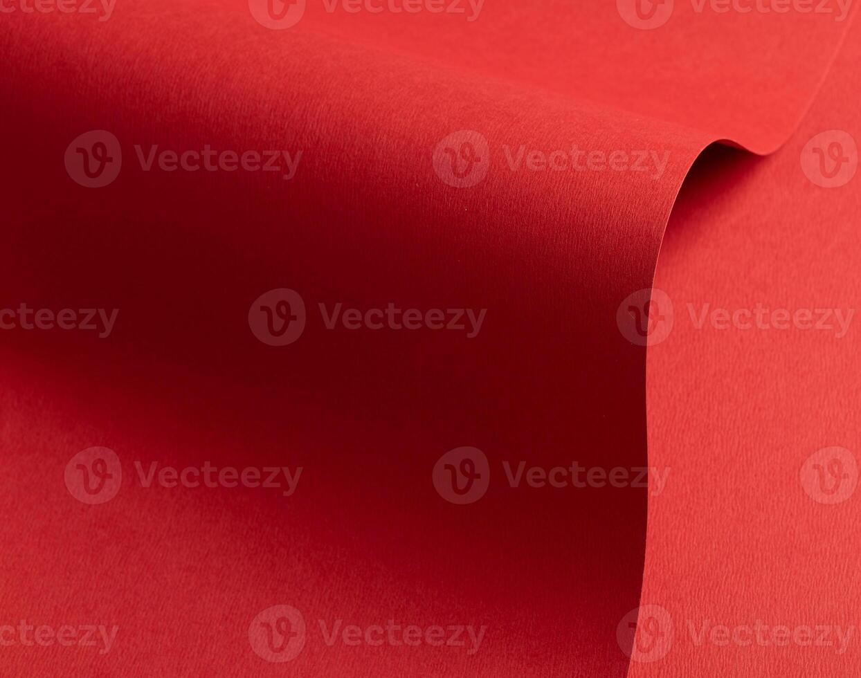 Crimson red paper texture with subtle wavy shapes and a matte finish. The vibrant, rich tones and photo
