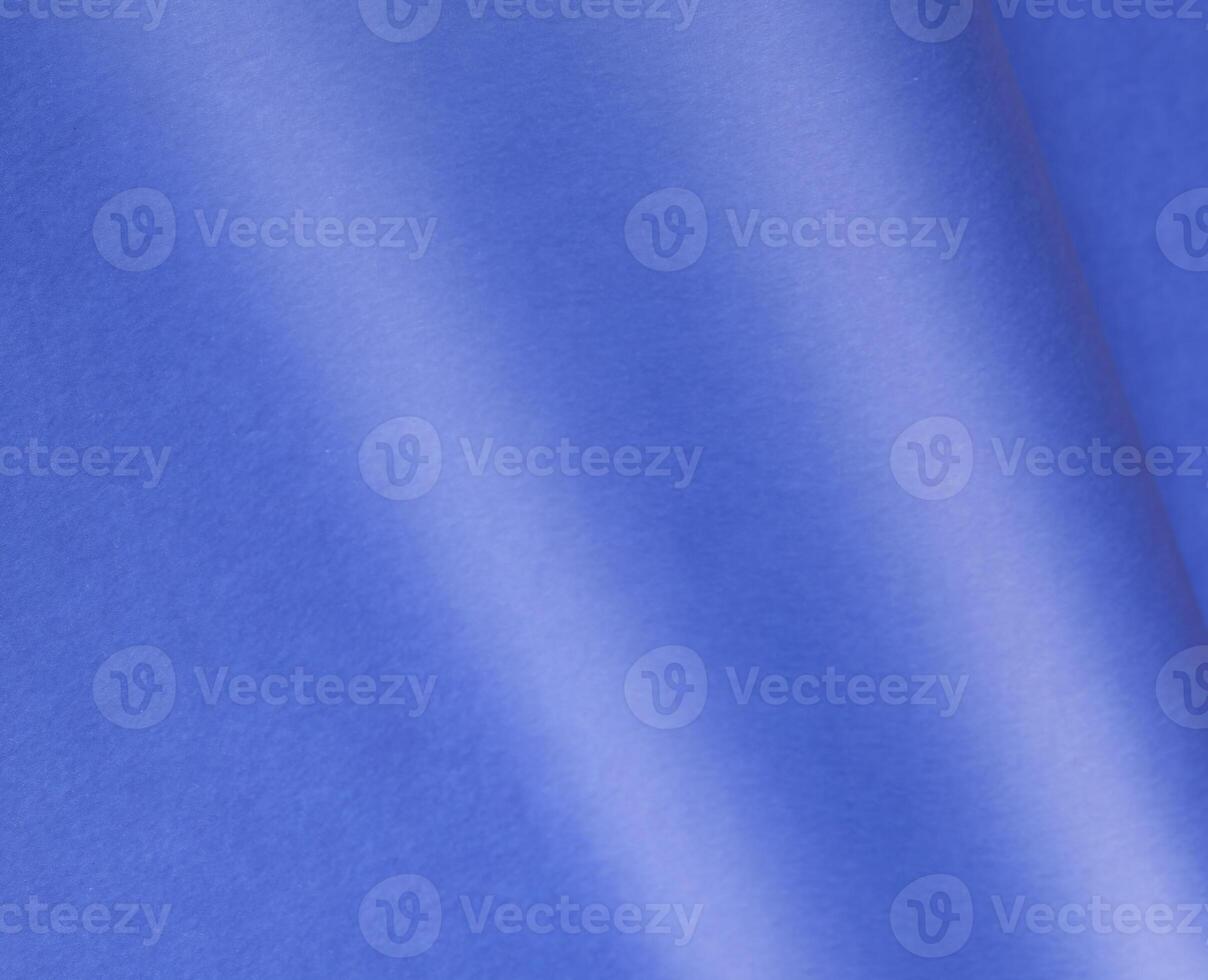 Elegant royal blue paper background with a matte finish and subtle grainy texture. Featuring a soft photo