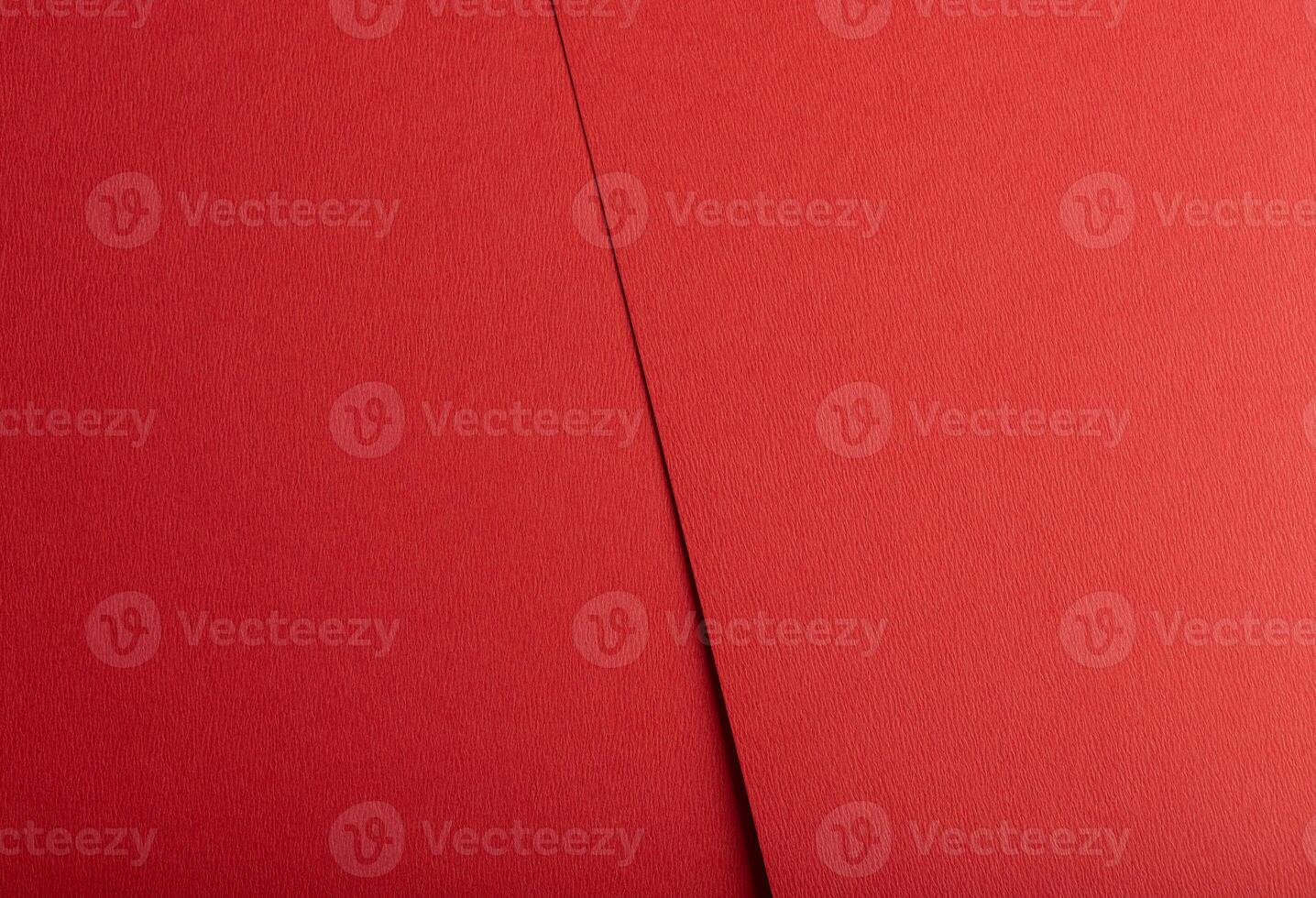 Crimson red paper texture with a matte, tactile surface and vibrant warm tones. The minimalist photo