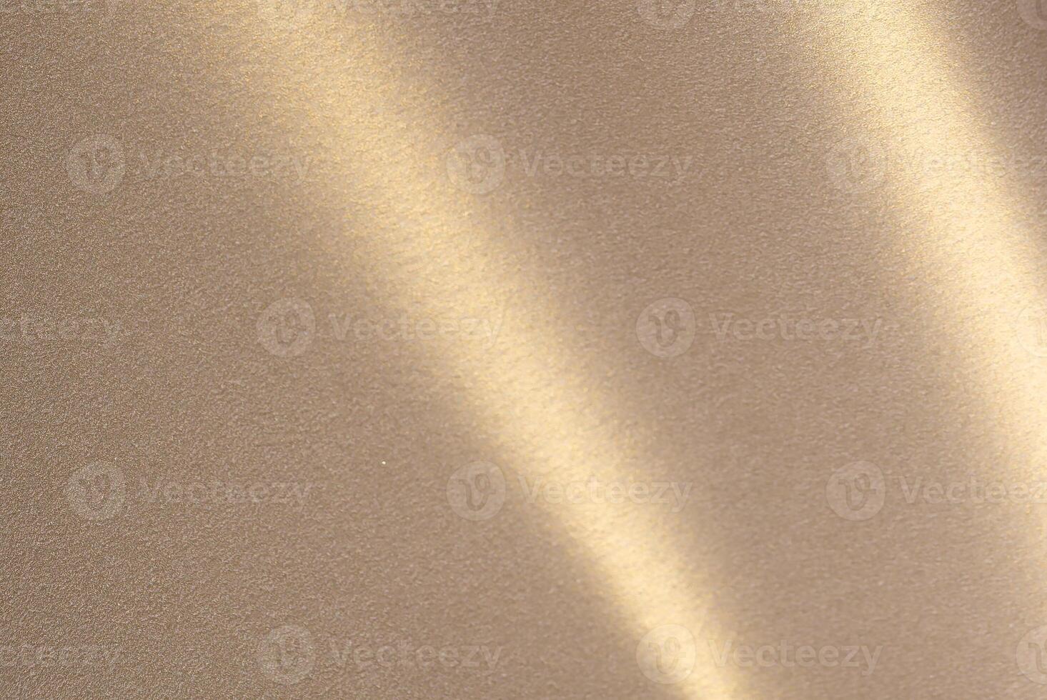 Luxurious paper background with a soft monochrome gradient in warm taupe and champagne tones. Smooth photo
