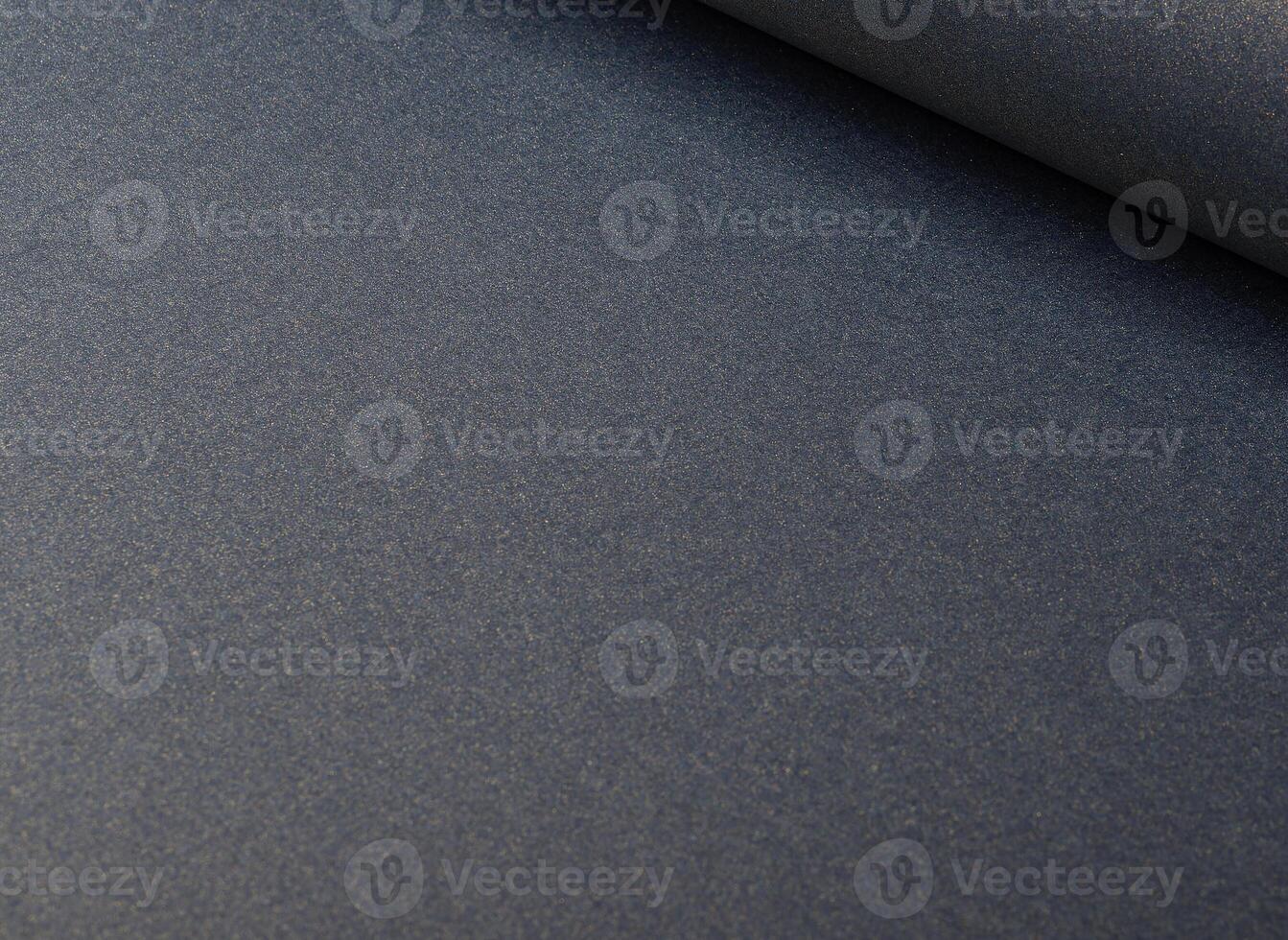 Luxurious muted blue paper background with a soft gradient and subtle grainy texture. Matte and photo