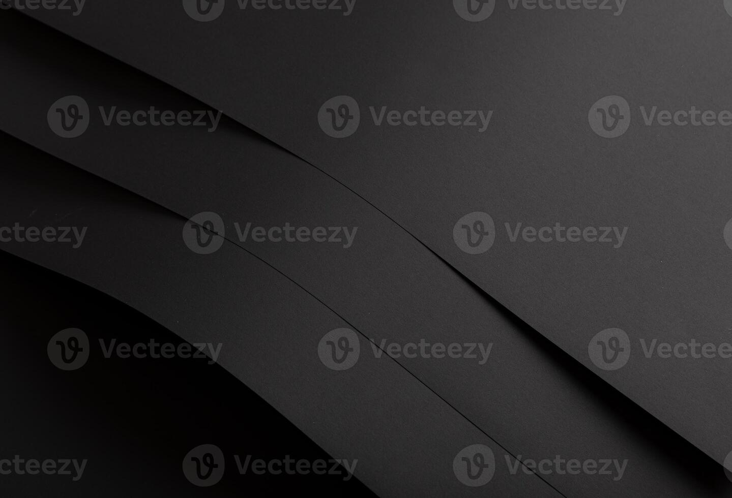 Luxurious black paper background with a smooth matte finish and subtle gradient. Deep black tones photo