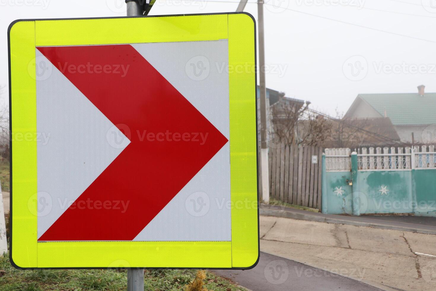 This sign clearly indicates a right turn ahead, giving important info for drivers photo