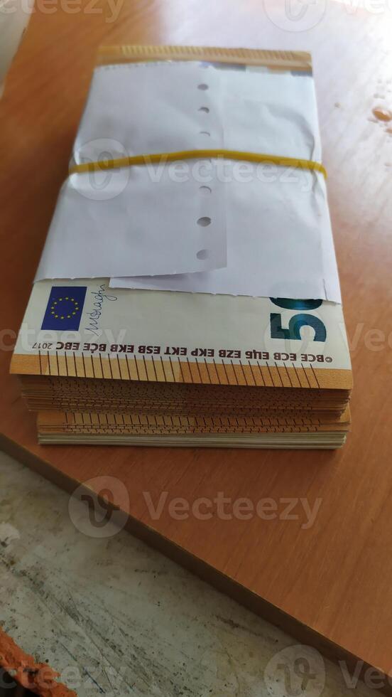 The Bundled Envelopes Are All Set and Ready for Dispatch to Ensure Efficient Delivery photo