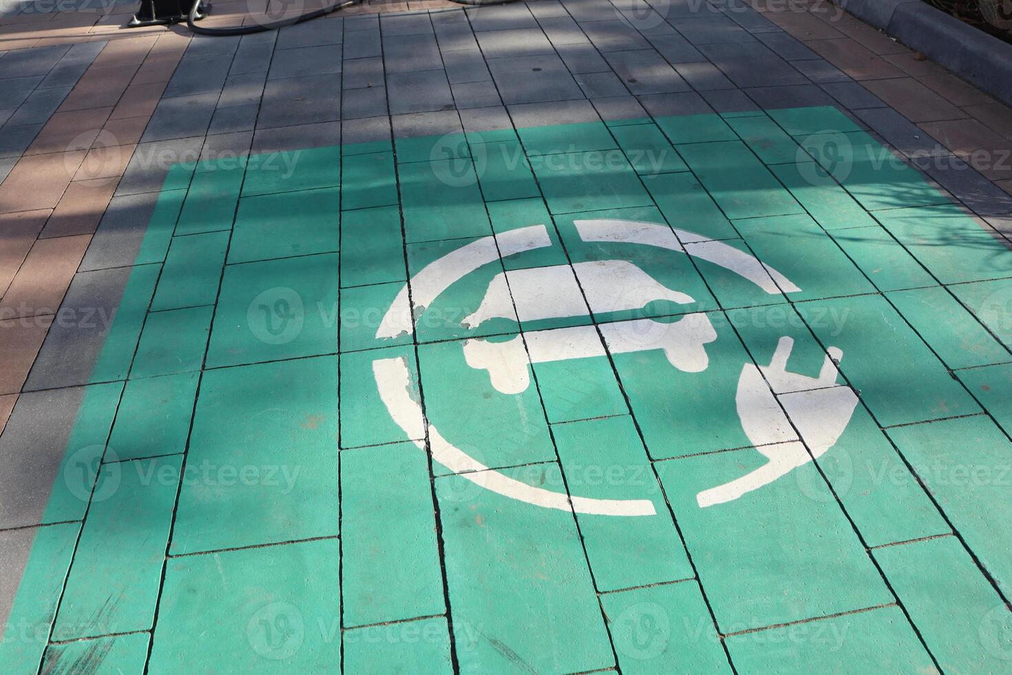 This image shows the Electric Vehicle Charging Station Symbol on the pavement as a driver marker photo