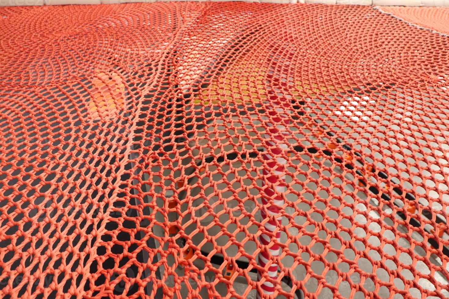 The Red Mesh Netting is beautifully placed over the surface, creating a bold visual effect photo