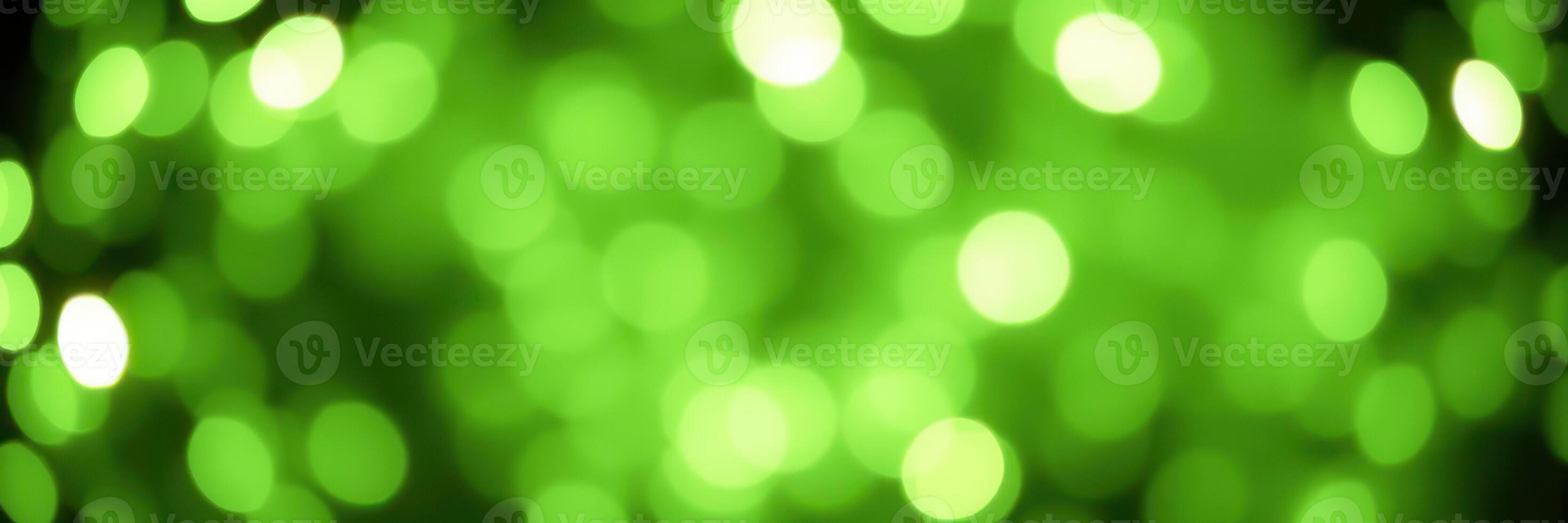 Vibrant green bokeh lights create a magical and enchanting atmosphere in a dark setting photo