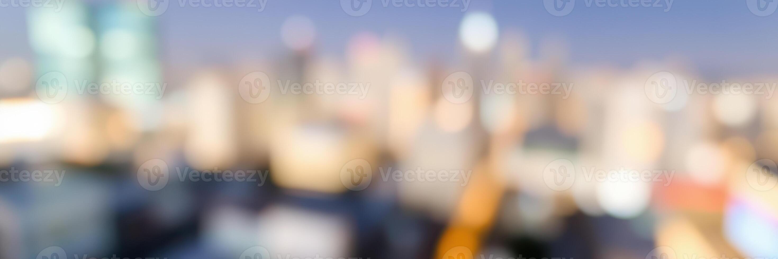 Urban skyline captured during golden hour with blurred city lights creating a vibrant backdrop photo