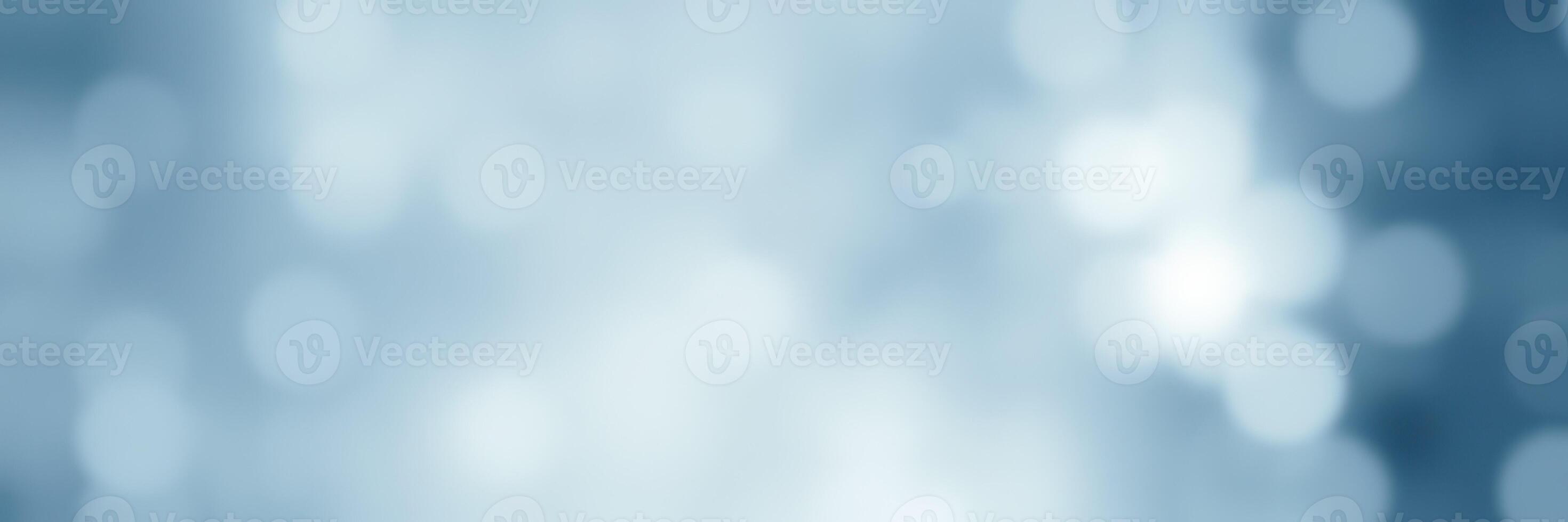 Soft blue bokeh background creates a serene and calming atmosphere for various creative projects photo