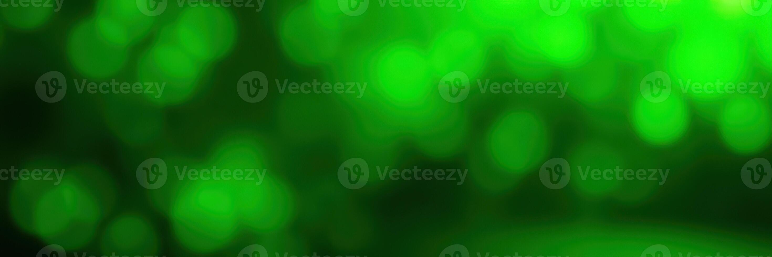 Colorful abstract background features various shades of green with a bokeh effect creating a vibrant and energetic atmosphere photo