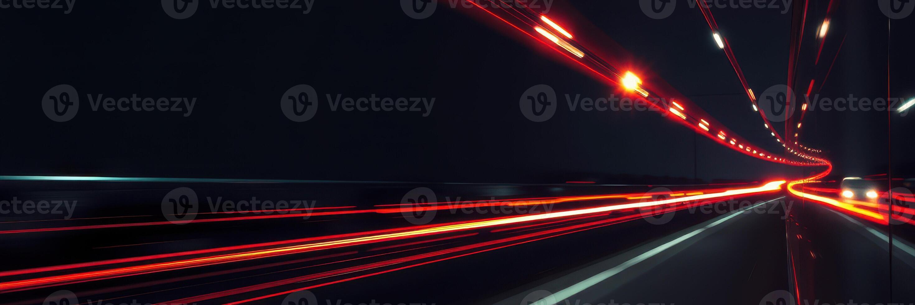 Long exposure captures light trails of vehicles on a highway at night, showcasing the vibrant night energy and motion photo