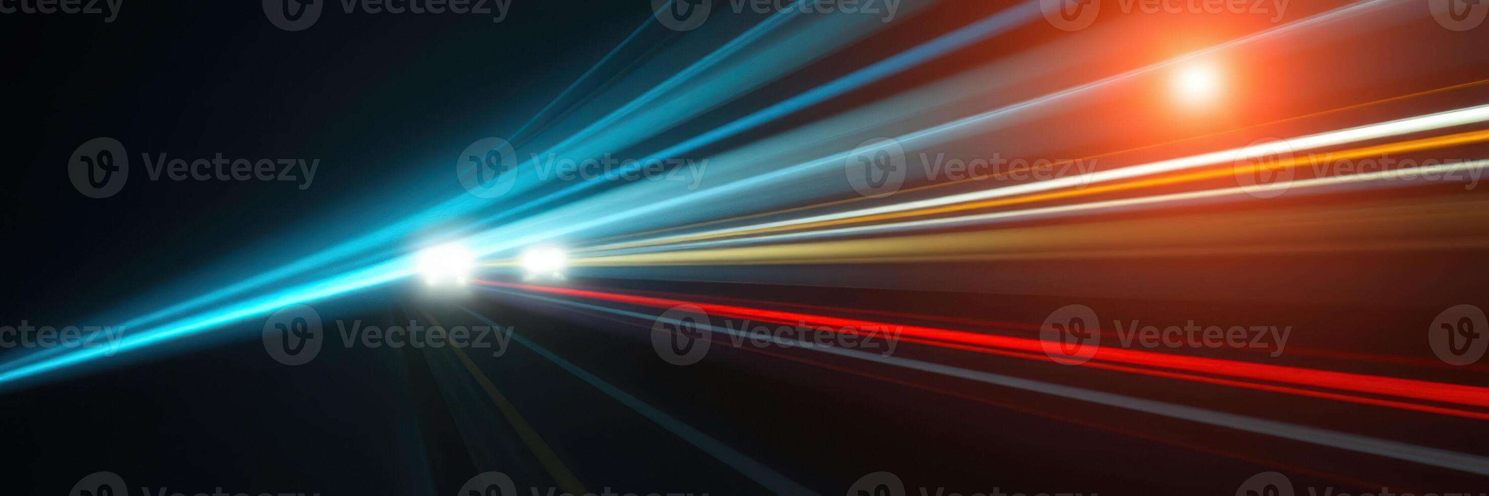 Vivid light trails create dynamic patterns on a dark road at night photo