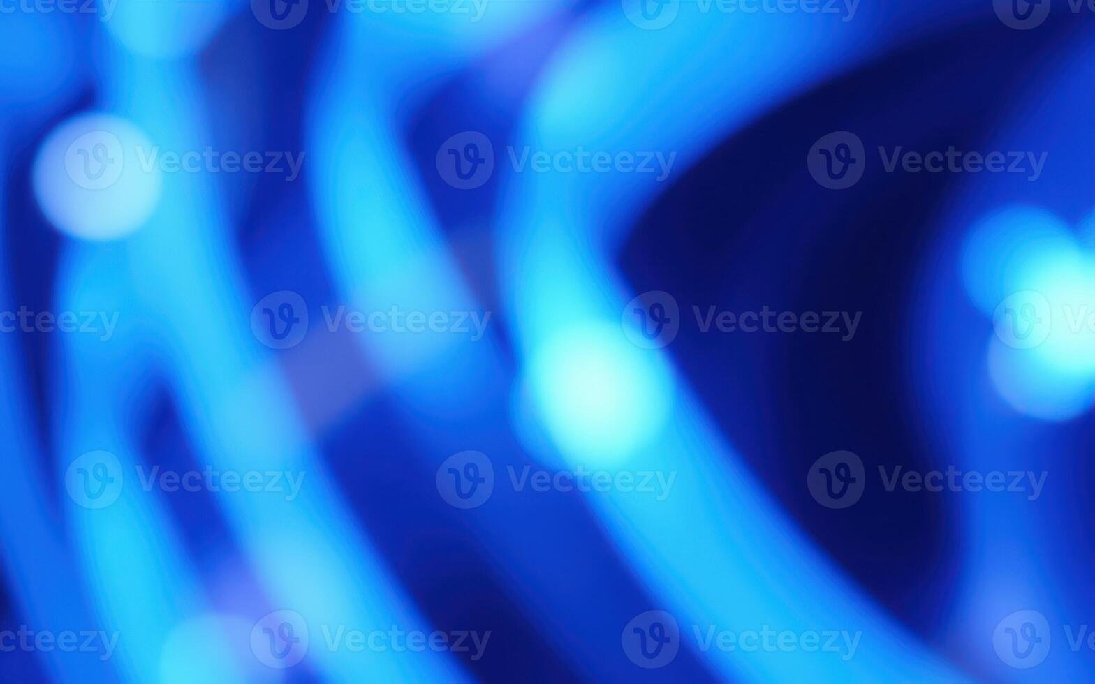 Vibrant blue abstract patterns created by glowing lights during a night event in an urban setting photo