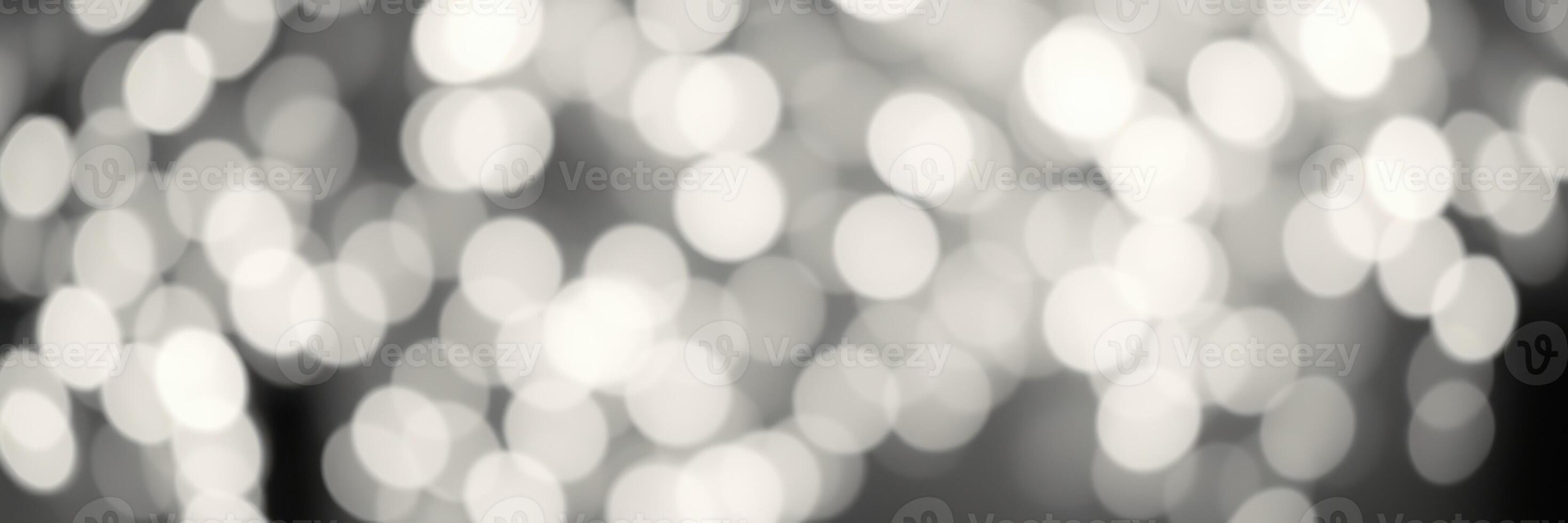 Soft bokeh lights create a dreamy atmosphere during an evening gathering in an outdoor setting photo