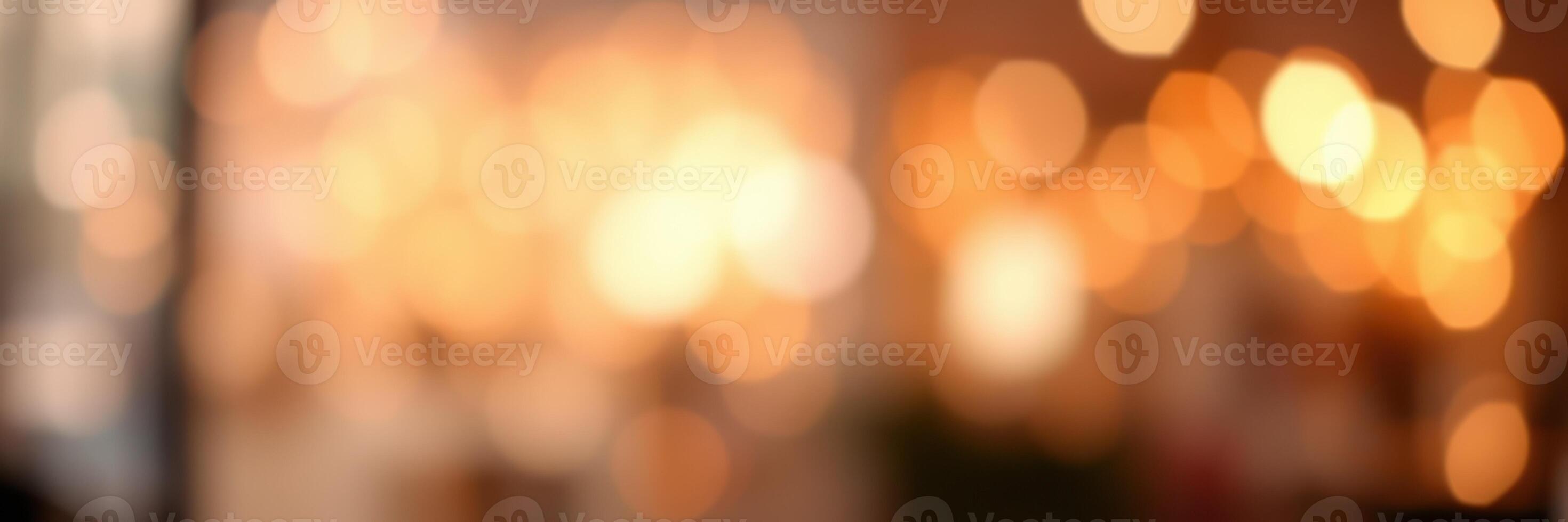 Warm golden bokeh lights create a soft atmosphere in a bustling cafe during an evening gathering photo