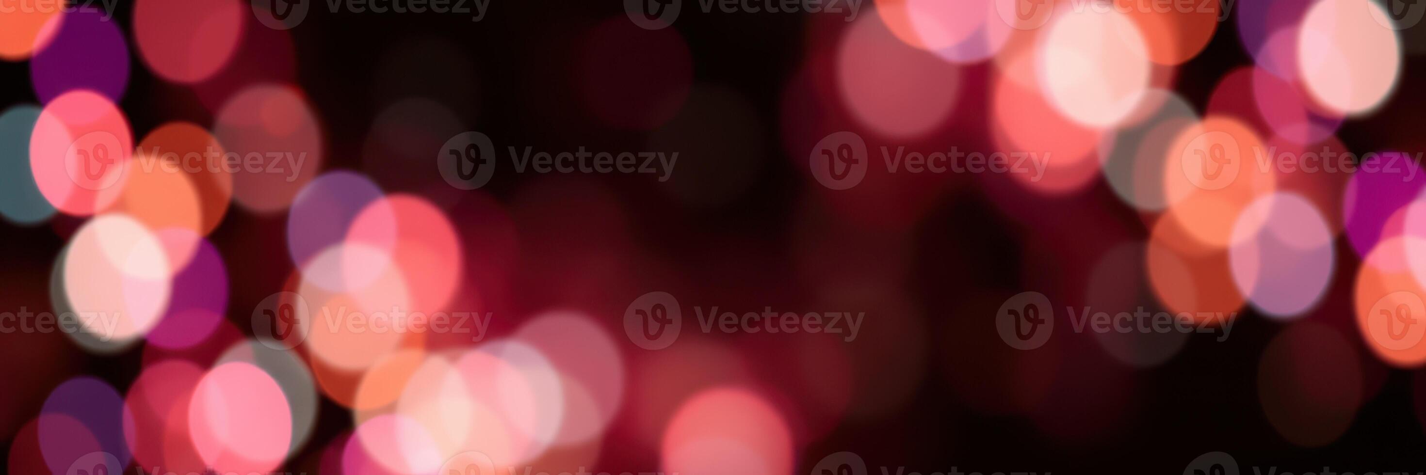 Colorful bokeh lights create a vibrant atmosphere during an evening celebration in a festive setting photo