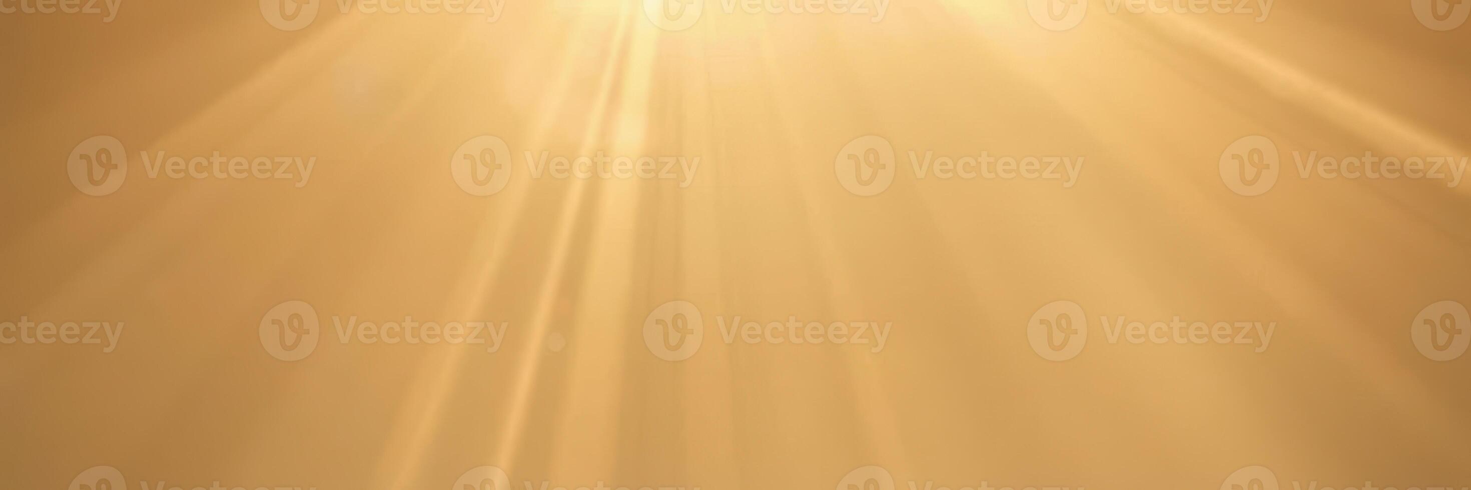 Bright sunlight streams through golden clouds at sunset, creating a warm atmosphere over the tranquil landscape photo