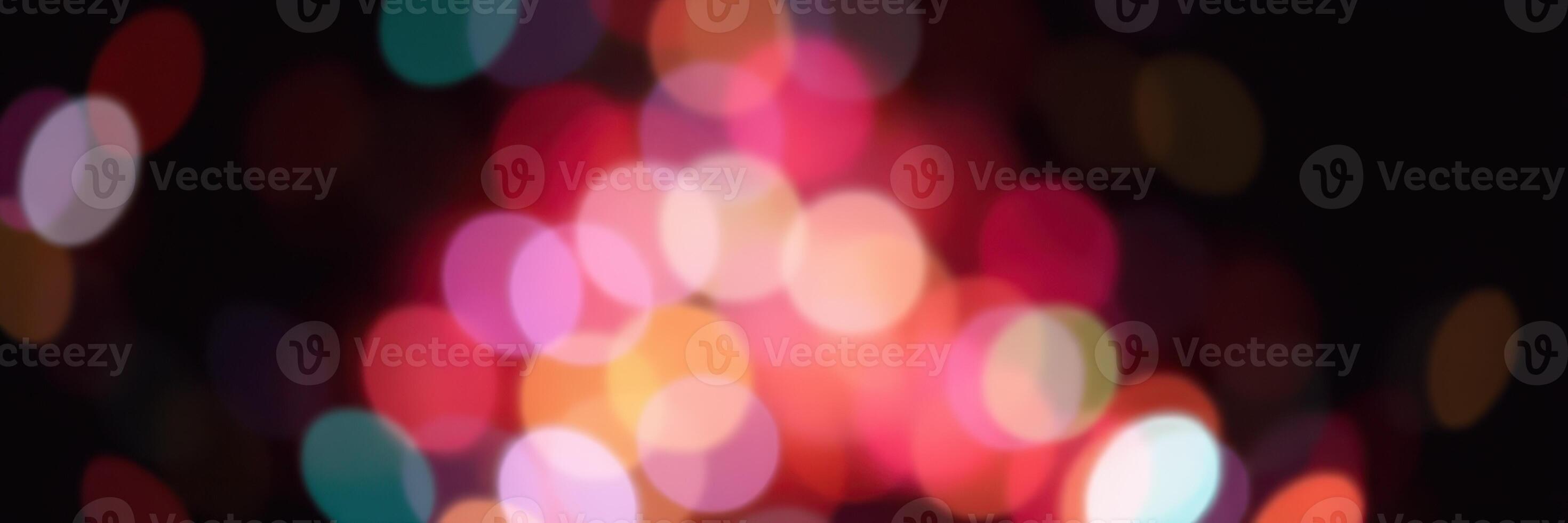 Colorful bokeh lights create a festive atmosphere during a nighttime celebration with vibrant hues and soft focus photo