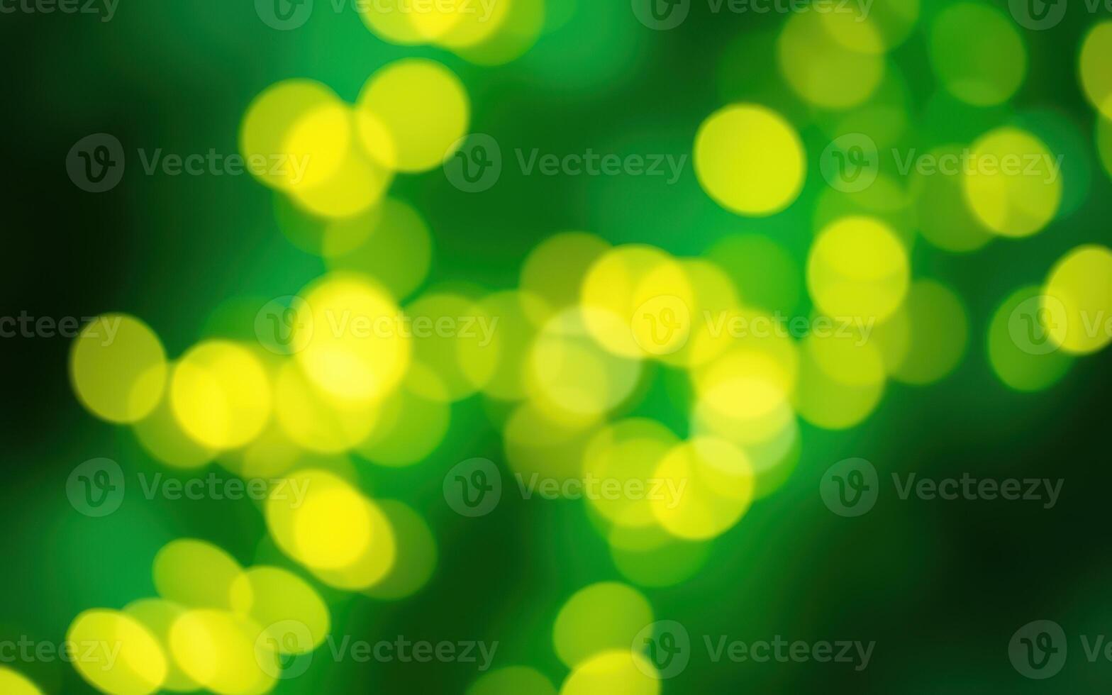 Vibrant green background featuring blurred yellow bokeh lights creating a festive atmosphere in a joyful celebration photo