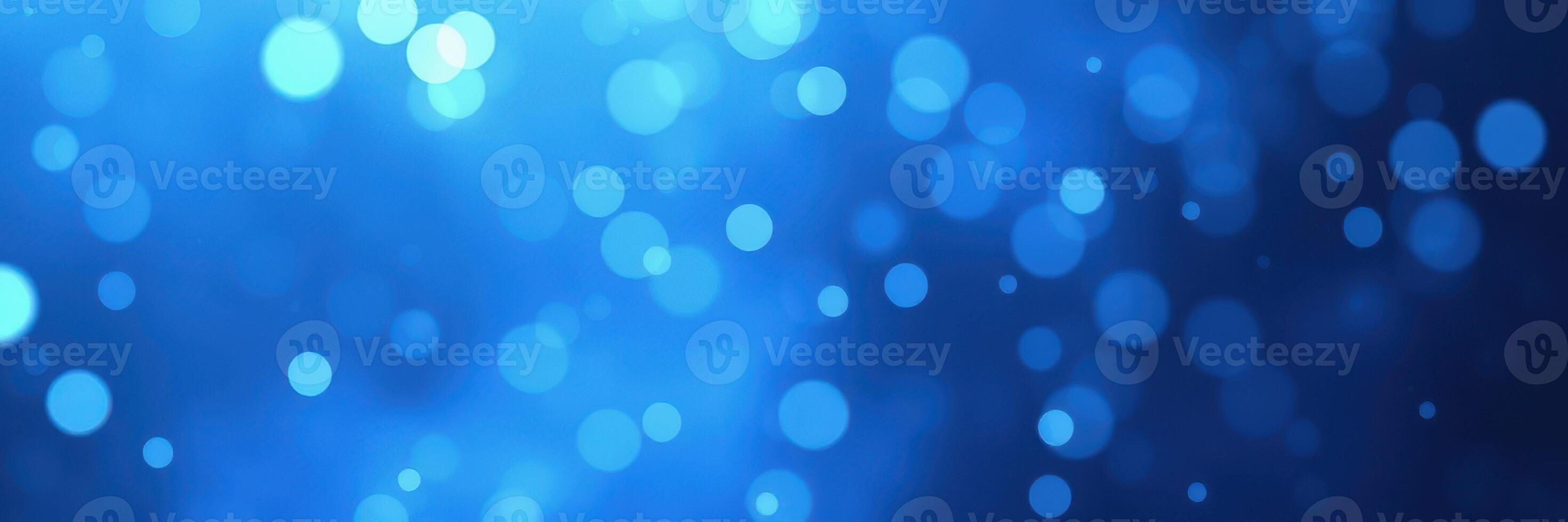 Vibrant blue bokeh background creating a serene and calming atmosphere for various artistic applications photo