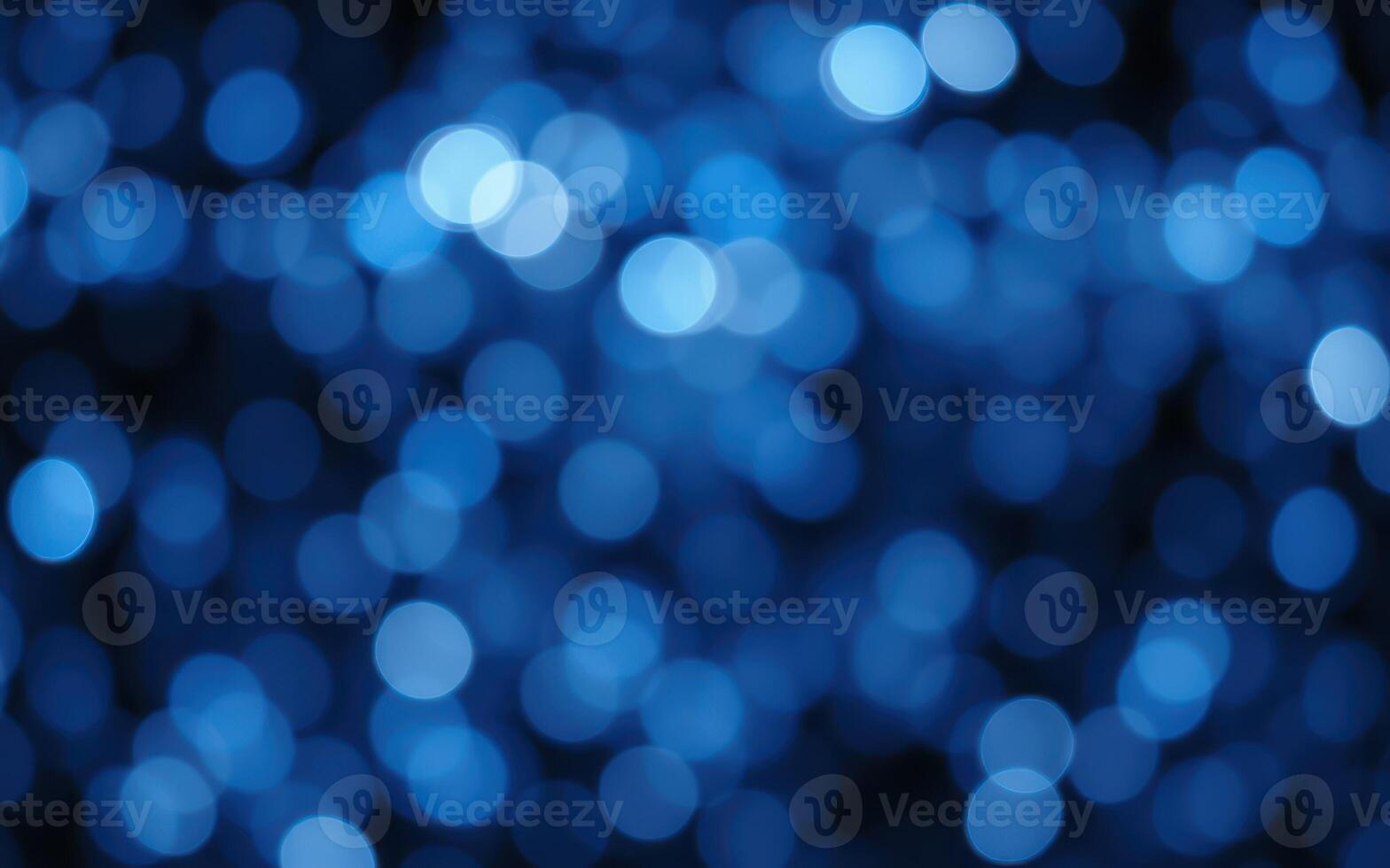 Colorful bokeh lights create a captivating blue atmosphere during a nighttime celebration photo
