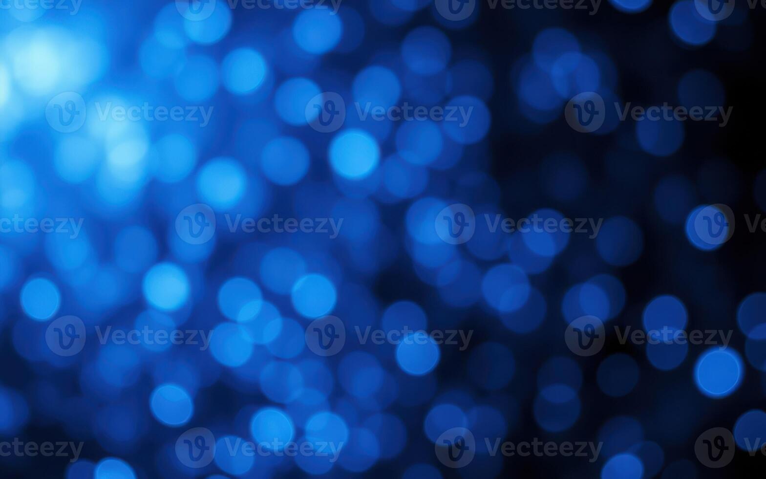 Soft blue bokeh lights create an enchanting atmosphere during a nighttime event in a city photo