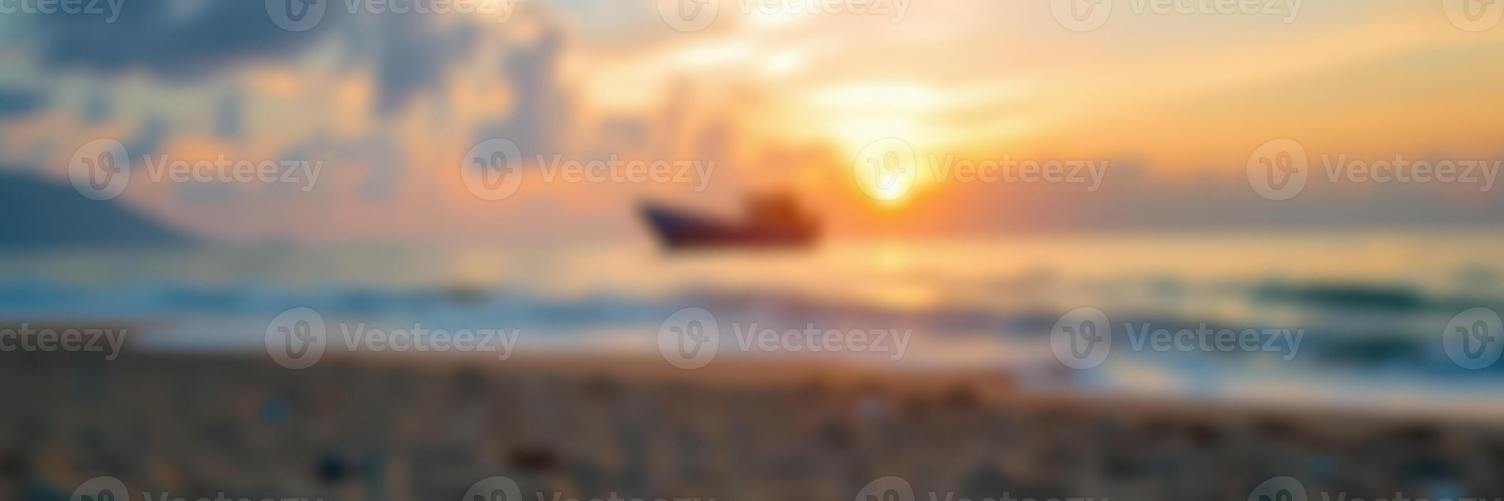 Beautiful sunset over calm ocean with boat silhouetted against the vibrant sky at a peaceful beach location photo