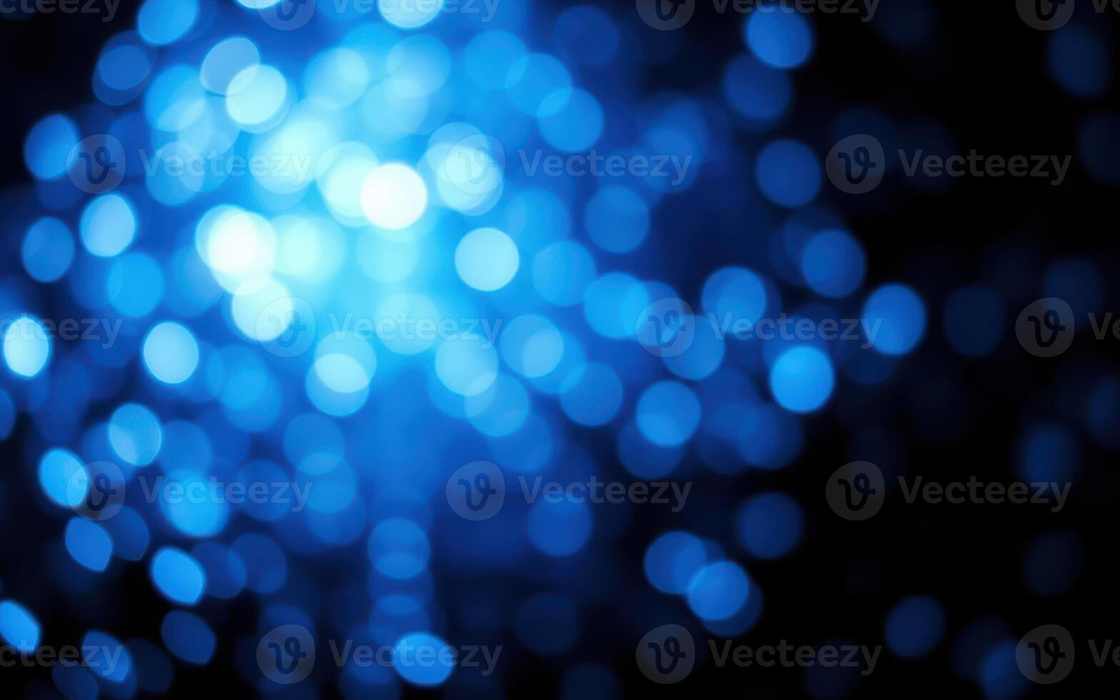 Vibrant blue bokeh lights create an enchanting atmosphere for nighttime events and celebrations photo