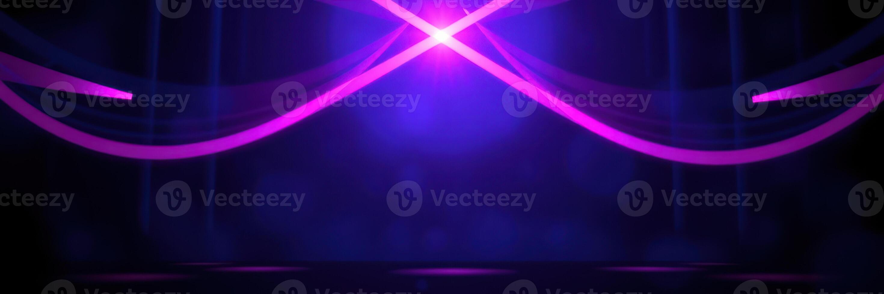 Vibrant purple light patterns create an energetic atmosphere in a dark setting during an evening event photo