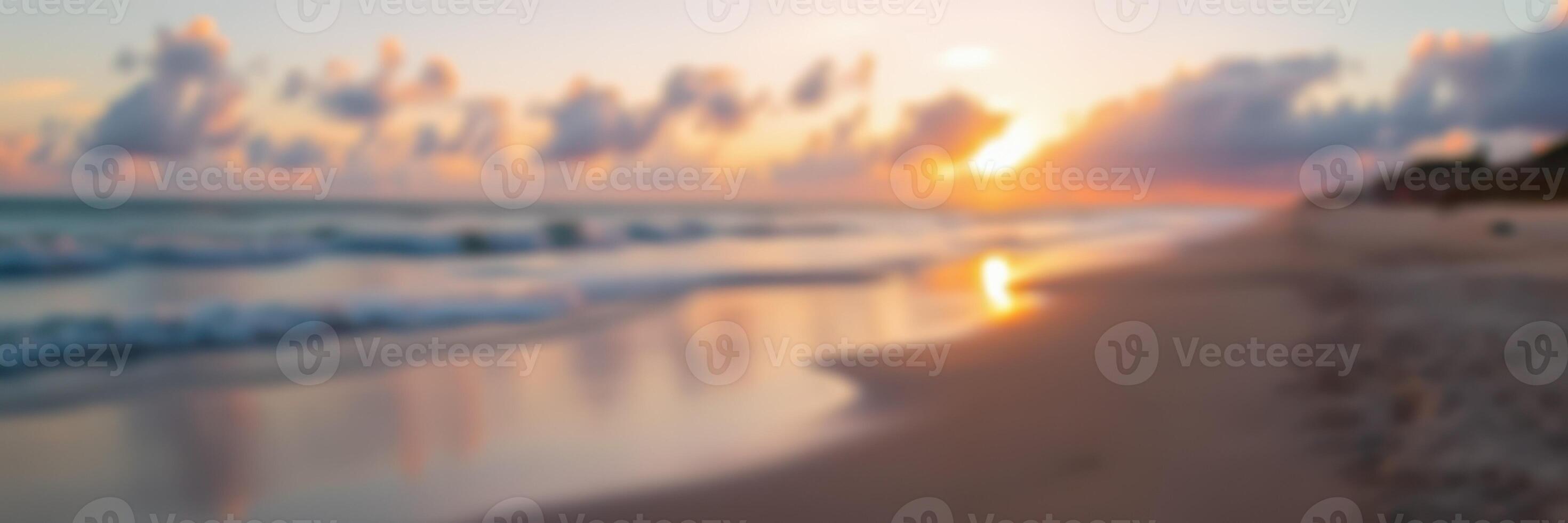 Sunset over tranquil beach with soft waves and colorful clouds in the evening sky photo